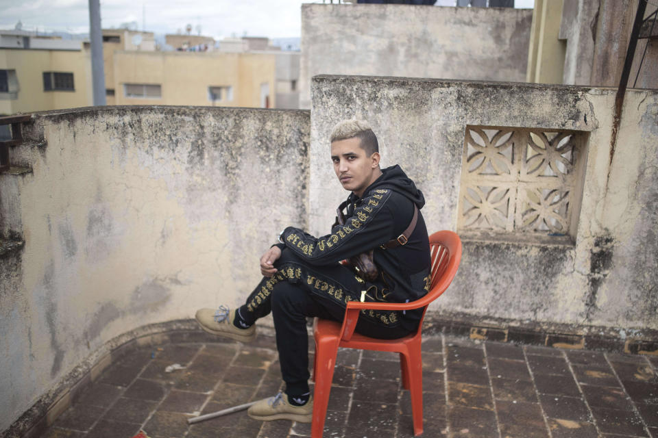 In this Thursday, Nov. 21, 2019 photo, Moroccan rapper Tarik El Tazi, known as Tflow, poses for a portrait in Fes, Morocco. (AP Photo/Mosa'ab Elshamy)