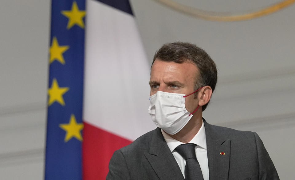 France's President Emmanuel Macron, meets French carmakers at the Elysee Palace in Paris, Monday, July 12, 2021. President Emmanuel Macron is hosting a top-level virus security meeting Monday morning and then giving a televised speech Monday evening, the kind of solemn speech he's given at each turning point in France's virus epidemic.(AP Photo/Michel Euler, Pool)