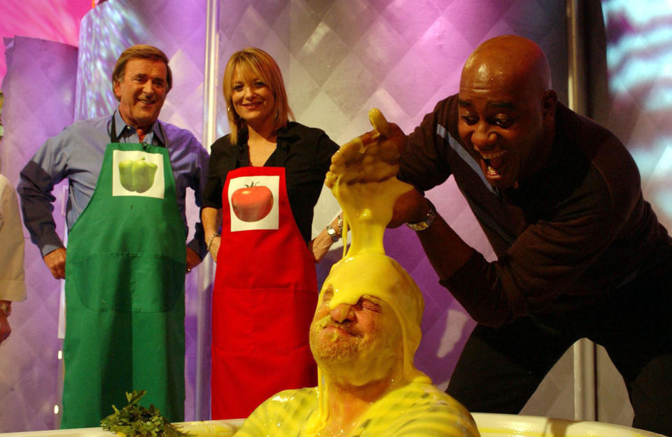 TV chef Anthony Worrall-Thompson gets gunged by fellow chefs Ainsley Harriott as special guests Terry Wogan and Gaby Roslin, look on during a special edition of 'Ready Steady Cook' in aid of 'Children In Need' at Capital Studios, south west London.   (Photo by Andy Butterton - PA Images/PA Images via Getty Images)