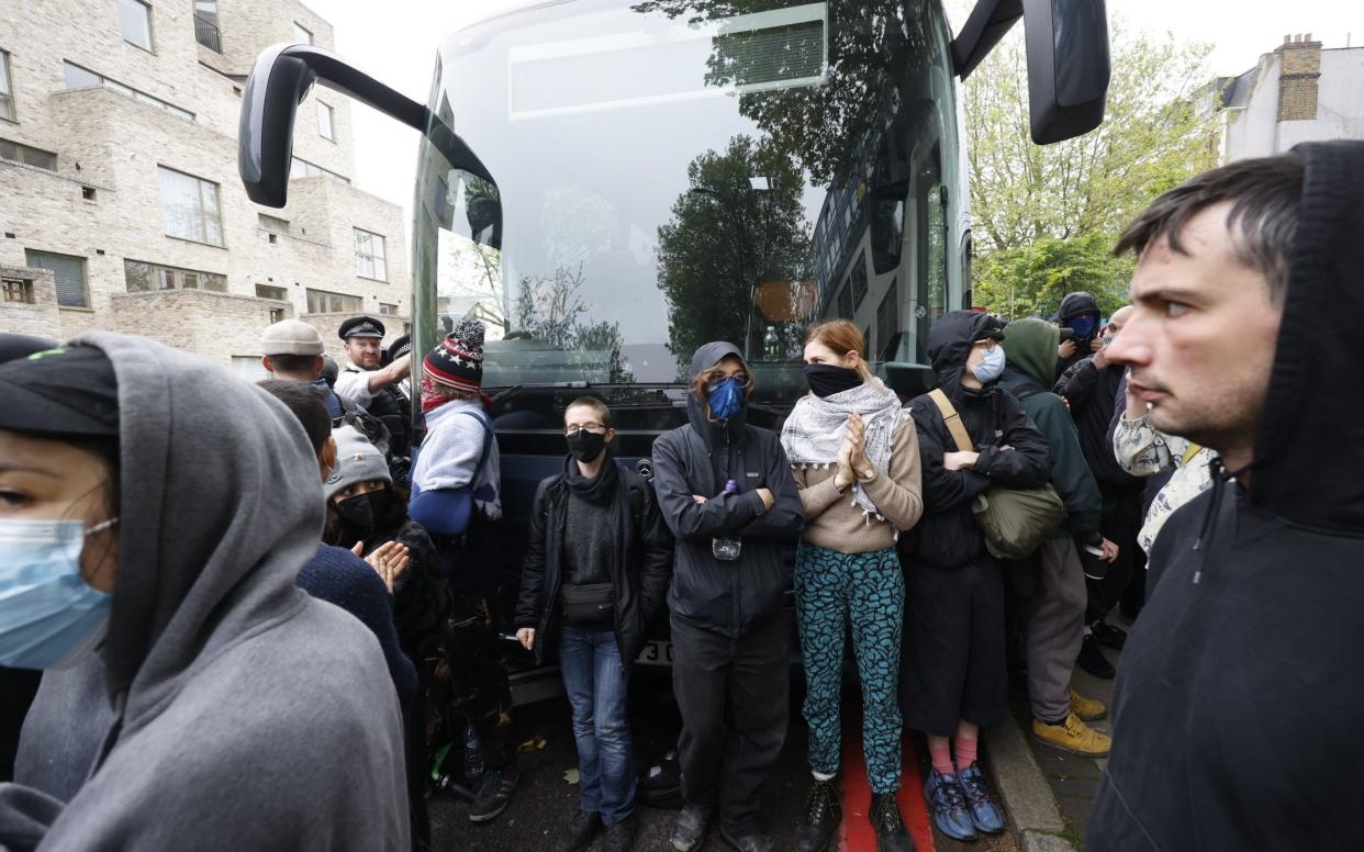 Protesters surround a coach supposedly removing asylum seekers from the Best Western hotel in Peckham, south London