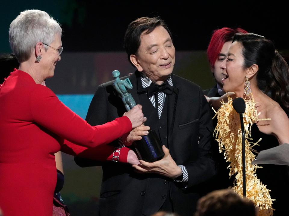 "Everything Everywhere All at Once" stars Jamie Lee Curtis (from left), James Hong and Michelle Yeoh celebrate their win for best ensemble at the 2023 Screen Actors Guild Awards.
