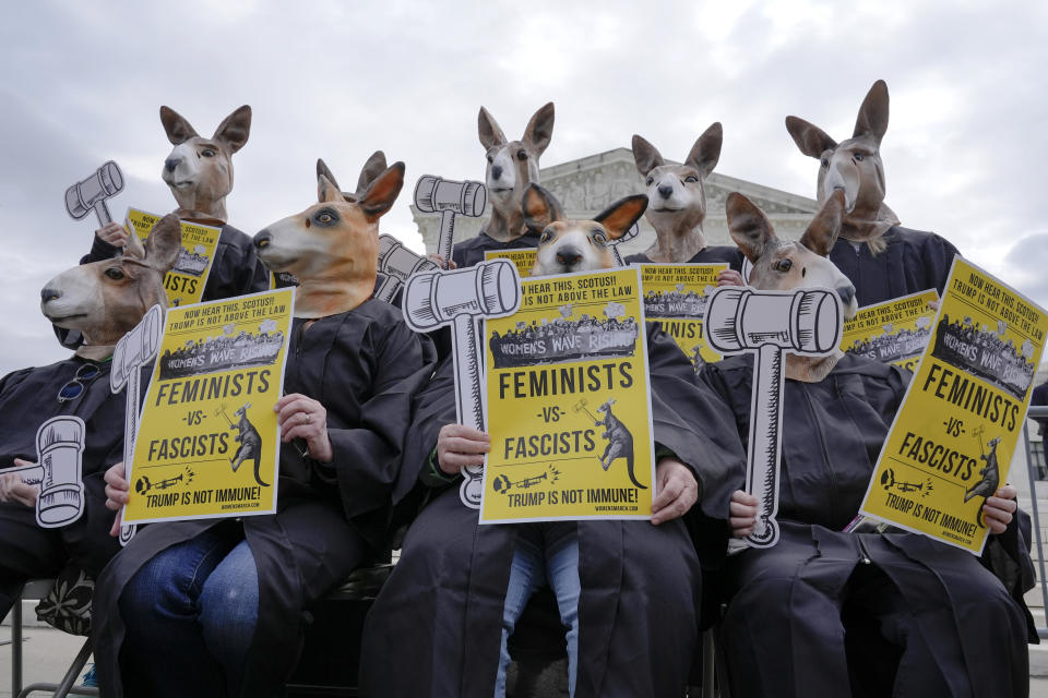 Demonstrators wearing kangaroo masks gather outside the Supreme Court as justices prepare to hear arguments on former President Donald Trump's immunity claims, on Capitol Hill in Washington, April 25, 2024. (AP Photo/Mariam Zuhaib)