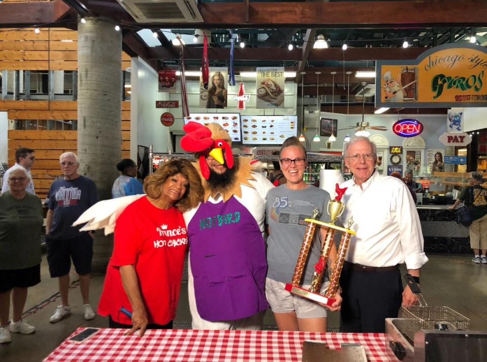 Hot Chicken Festival Amateur Contest winning team, Team Alonzo, led by Kali Alonzo with her husband Nick on June 29, 2022. The pair are posing with André Prince Jeffries and former Mayor and festival founder Bill Purcell.