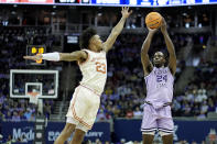 Kansas State forward Arthur Kaluma (24) shoots under pressure from Texas forward Dillon Mitchell (23) during the first half of an NCAA college basketball game Wednesday, March 13, 2024, in Kansas City, Mo. (AP Photo/Charlie Riedel)