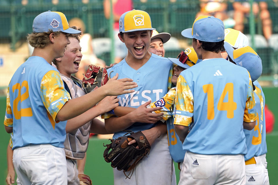 El Segundo, Calif.'s Louis Lappe , center, celebrates with Jaxon Kalish (22), catcher Lucas Keldorf, Max Baker (13) Lennon Salazar (3) and Brody Brooks (14) after their win over Needville, Texas, in the United States Championship baseball game at the Little League World Series tournament in South Williamsport, Pa., Saturday, Aug. 26, 2023. (AP Photo/Tom E. Puskar)