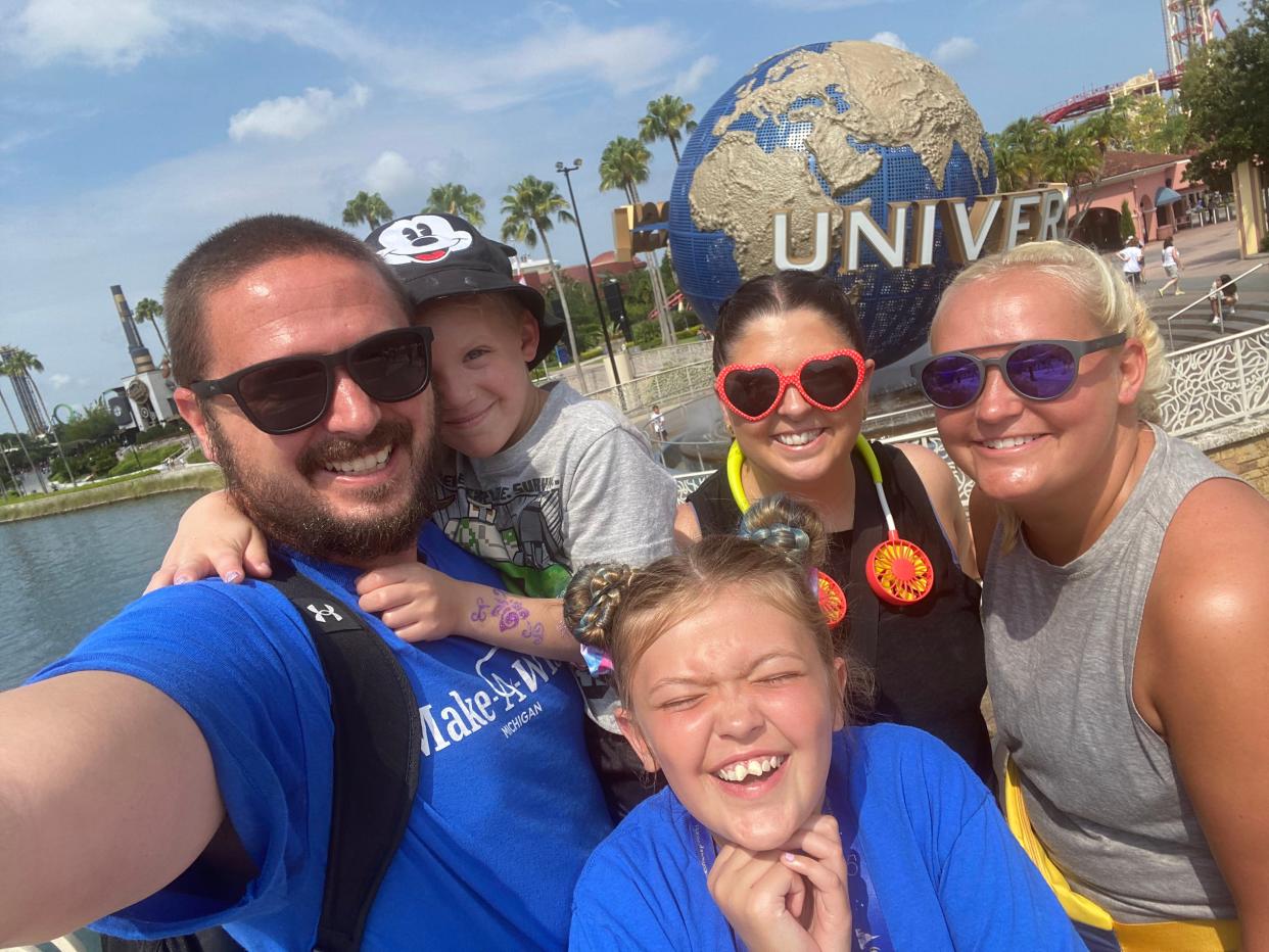 Battle Creek Enquirer reporter Nick Buckley (left) with his son Oliver, daughter Charlie, sister Elizabeth Precopio and wife Alexis Buckley, in a selfie during their Make-A-Wish trip to Universal Studios in Orlando, Florida, on Saturday, June 25, 2022.
