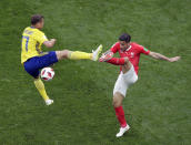 <p>Sweden’s Viktor Claesson, left, duels for the ball with Switzerland’s Ricardo Rodriguez during the round of 16 match between Switzerland and Sweden at the 2018 soccer World Cup in the St. Petersburg Stadium, in St. Petersburg, Russia, Tuesday, July 3, 2018. (AP Photo/Dmitri Lovetsky) </p>