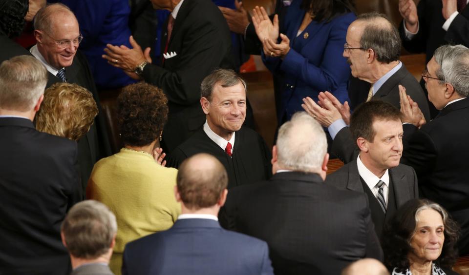 Supreme Court Justice Kennedy and Chief Justice Roberts arrive for President Obama's State of the Union address to a joint session of the U.S. Congress on Capitol Hill in Washington