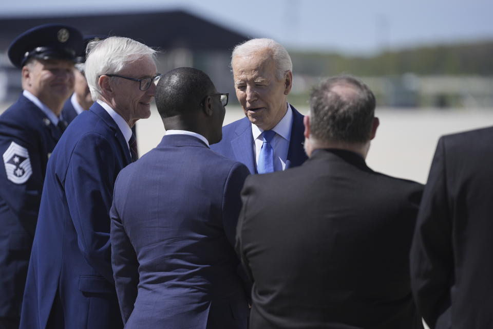 President Joe Biden is greeted by Wisconsin Gov. Tony Evers, Racine Mayor Cory Mason, Milwaukee County Executive David Crowley, and Racine County Executive Jonathan Delagrave, as he arrives at Milwaukee Mitchell International Airport, Wednesday, May 8, 2024, in Milwaukee. (AP Photo/Evan Vucci)