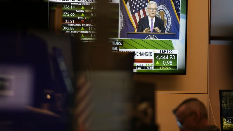 A press conference by Federal Reserve Chairman Jerome Powell is displayed on the floor at the New York Stock Exchange in New York, Wednesday, Sept. 20, 2023. The Federal Reserve left its key interest rate unchanged for the second time in its past three meetings, a sign that it’is moderating its fight against inflation as price pressures have eased.