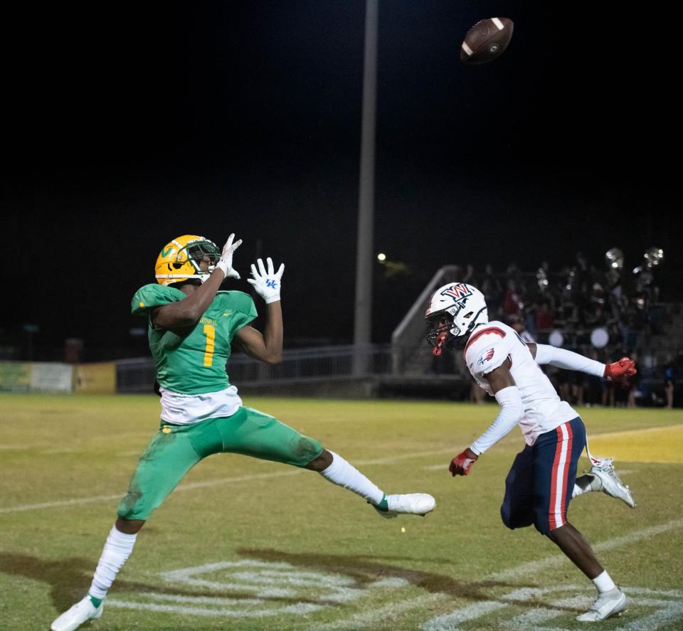 Koby Howard (1) reels in a long pass during the Wakulla vs Catholic football game at Pensacola Catholic High School in Pensacola on Friday, Nov. 11, 2022.