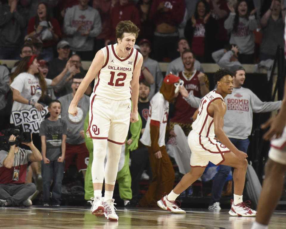 Oklahoma guard Austin Reaves (12) celebrates after dunking the ball during the first half of an NCAA college basketball game against Oklahoma St. in Norman, Okla., Saturday, Feb. 1, 2020. (AP Photo/Kyle Phillips)