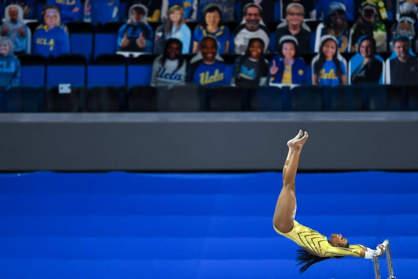 LOS ANGELES, CALIFORNIA FEBRUARY 10, 2021-UCLA's Nia Dennis competes on the uneven bars during competition against BYU at Pauley Pavillion Wednesday. (Wally Skalij/Los Angeles Times)