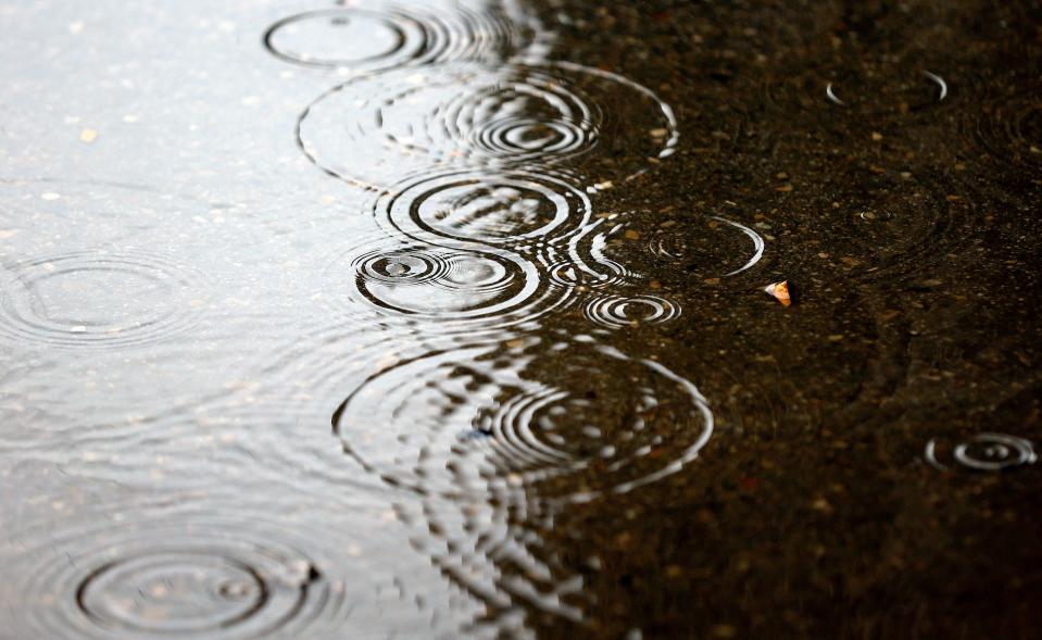 Raindrops fall in a puddle in Salt Lake City on Tuesday, Aug. 22, 2023. | Kristin Murphy, Deseret News