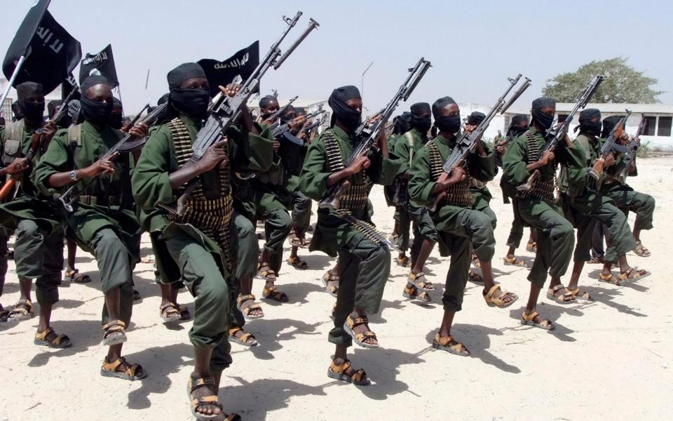 Newly-trained Al Shabaab fighters perform military exercises - AP Photo/Farah Abdi Warsameh