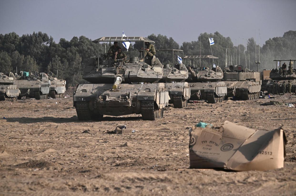 Armored Israeli military vehicles maneuver near Israel's border with Gaza. <a href="https://www.gettyimages.com/detail/news-photo/israeli-military-armoured-vehicles-and-tanks-deploy-along-news-photo/1742240506" rel="nofollow noopener" target="_blank" data-ylk="slk:Aris Messinis/AFP via Getty Images;elm:context_link;itc:0;sec:content-canvas" class="link ">Aris Messinis/AFP via Getty Images</a>