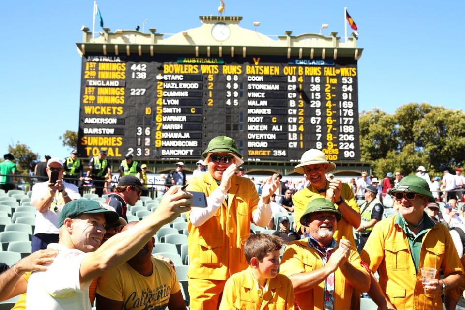 David Warner poses with Australia fans before the iconic scoreboard at Adelaide Oval (Getty Images)