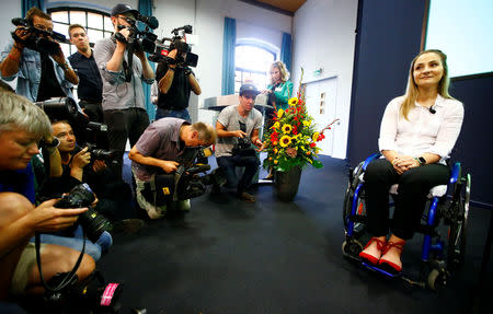 Germany's Olympic and world sprint cycling champion Kristina Vogel addresses a news conference for the first time since being paralysed following a serious crash in training, at the Unfallkrankenhaus hospital in Berlin, Germany, September 12, 2018. REUTERS/Fabrizio Bensch?