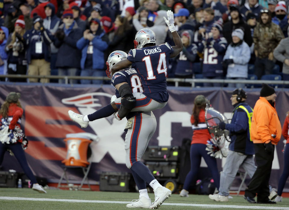 Giddyup: Patriots receiver Brandin Cooks jumped on Rob Gronkowski’s back to celebrate a fourth-quarter touchdown in New England’s win. (AP)