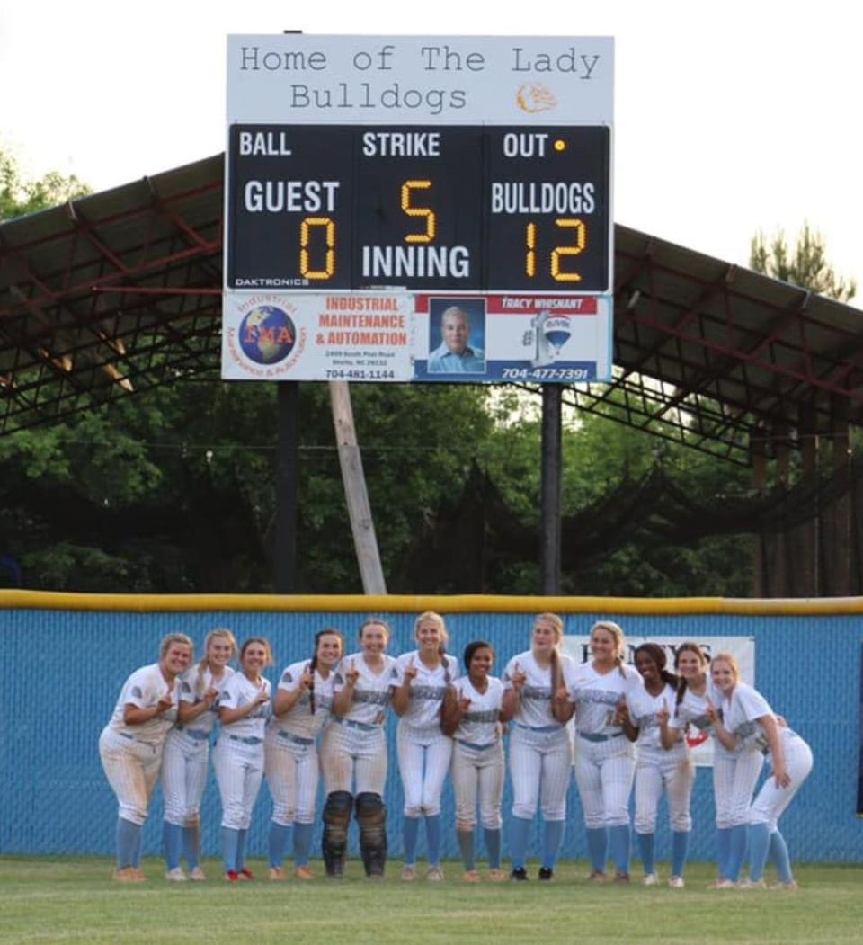 Burns softball celebrates its Southern Piedmont 1A/2A conference championship following a 12-0 win over East Gaston.