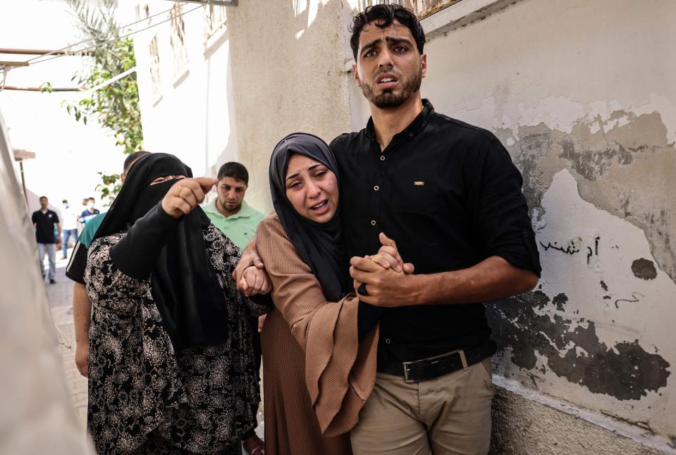 Image: Relatives mourn the death of two members of the Palestinian Alrantisi family, killed in an Israeli air strike, at their funeral in Rafah in the southern Gaza Strip, (Said Khatib / AFP - Getty Images)