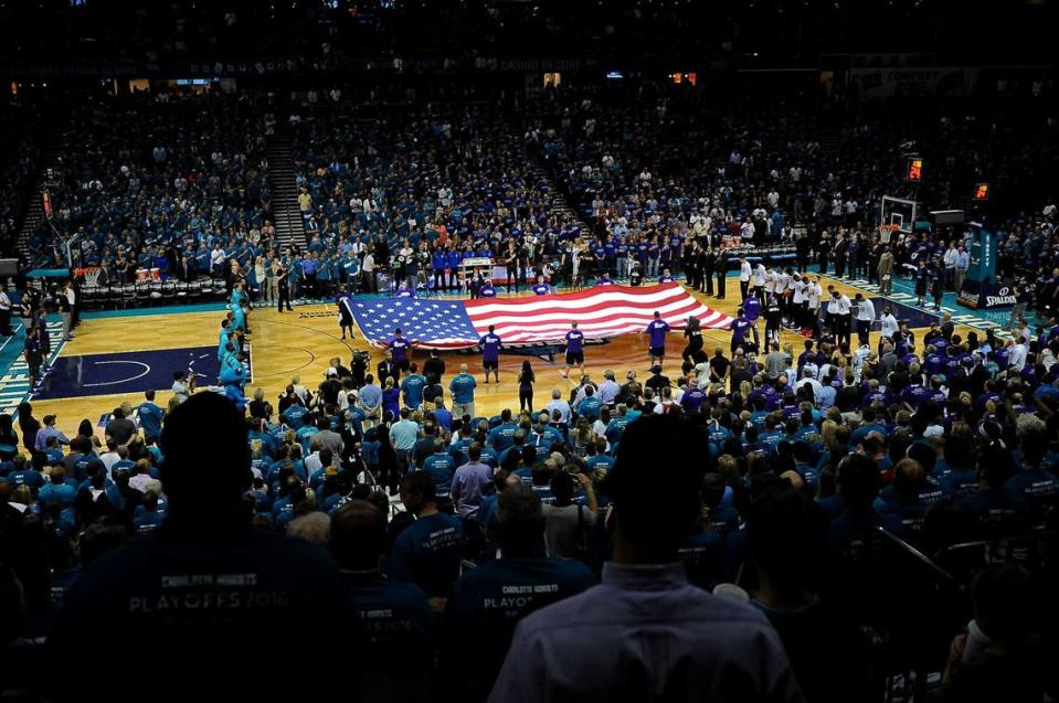 Fans are on their feet as the National Anthem is sang at Time Warner Cable Arena on Friday, April 29, 2016 in Charlotte, NC. The Charlotte Hornets hosted the Miami Heat in Game 6 of the First Round of the NBA Playoffs. The Hornets lost to the Heat 97-90.