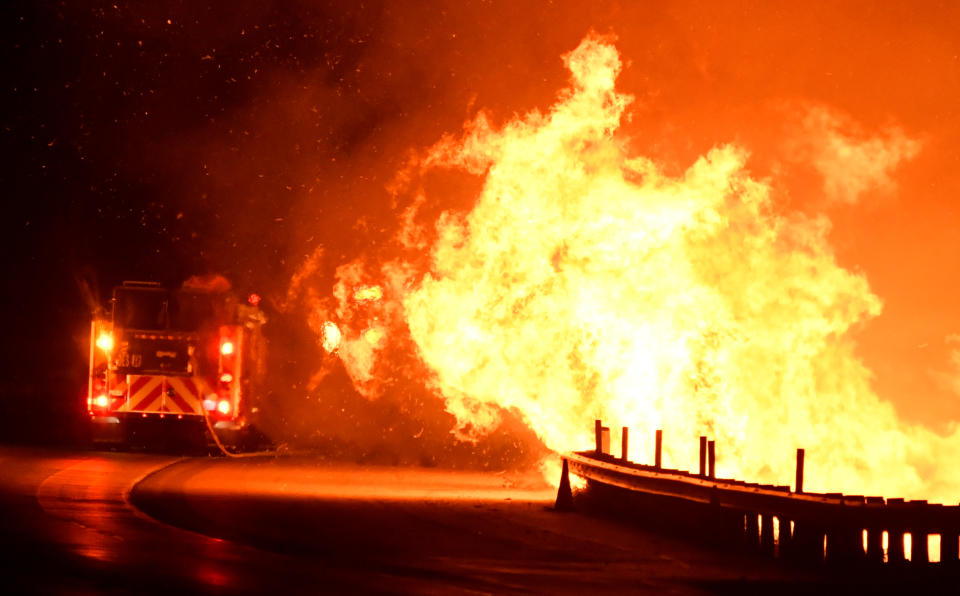 Firefighters battle a fire, as a wind driven wildfire continues to burn in Canyon Country north of Los Angeles, California, Oct. 25, 2019. (Photo: Gene Blevins/Reuters)