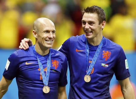 Arjen Robben (L) and Stefan de Vrij of the Netherlands celebrate after winning their 2014 World Cup third-place playoff against Brazil at the Brasilia national stadium in Brasilia July 12, 2014. REUTERS/Dominic Ebenbichler