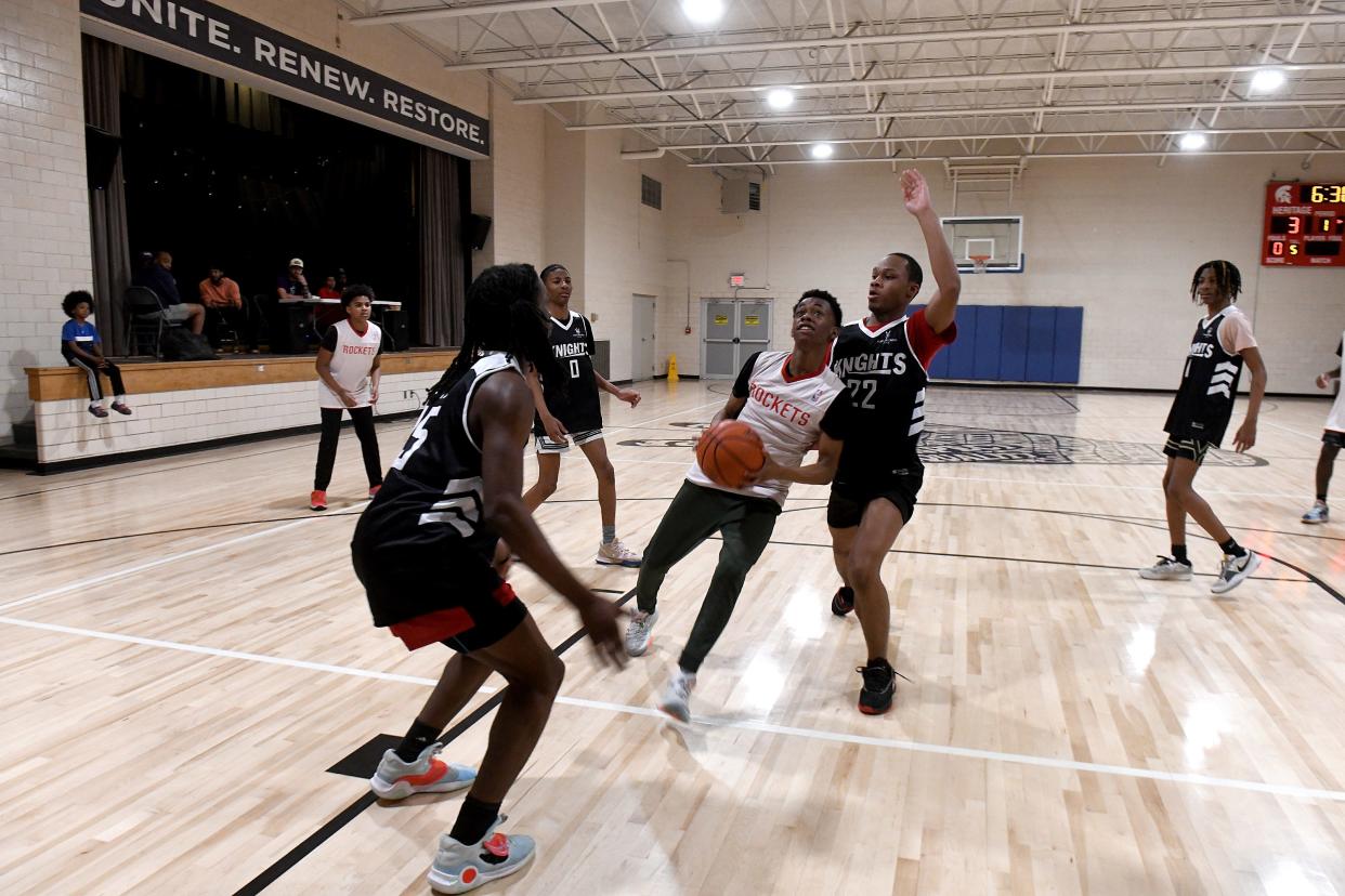 The action is intense at the Martin Center in Canton, which is hosting Taking the Crown, a mentoring program for boys that sponsors a basketball league. About 350 middle school and high school boys take part in the league started by Patrick Allen in 2016.