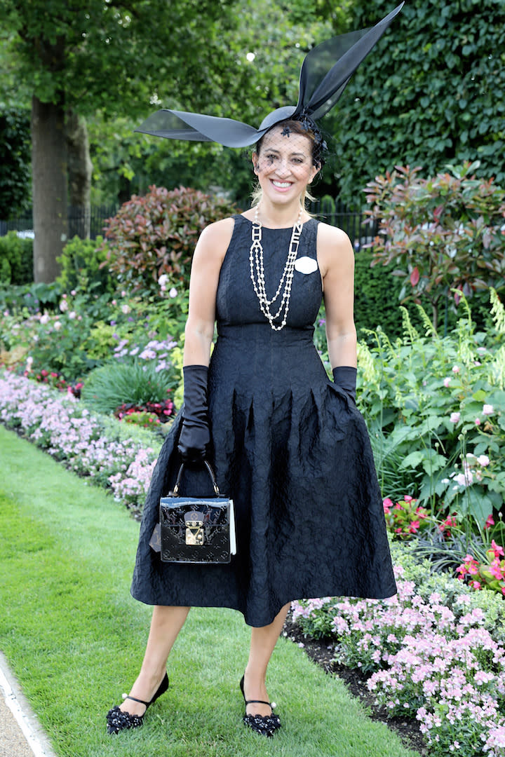 Guest Nazar Bullen proved you can stick to all-black in the summer months and still look chic courtesy of a puffball dress, matching gloves and a Louis Vuitton bag. <em>[Photo: Getty]</em>