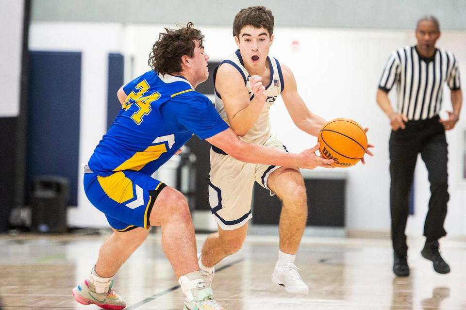 Stone Ridge Christian junior Luke Agueda (1) dribbles up the court during a NorCal Regional playoff game against Point Arena at Stone Ridge Christian High School in Merced, Calif., on Wednesday, Feb. 28, 2024. The Knights beat the Pirates 78-67.