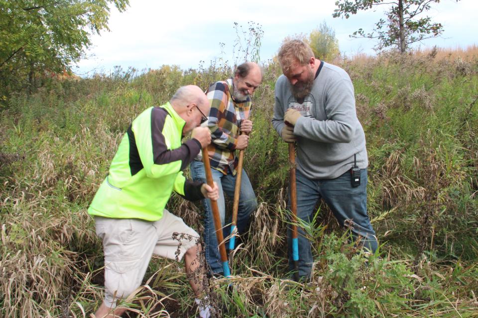 Ken Leinbach, center, helps plant an oak tree Oct. 18 at the Rotary Centennial Arboretum at the Urban Ecology Center's Riverside Park location. Leinback served as UEC's executive director from June 1998 through June 2023. Assisting him in the tree planting are UEC volunteer Kevin Whaley (left) and Jeremy Rappaport, UEC land steward.