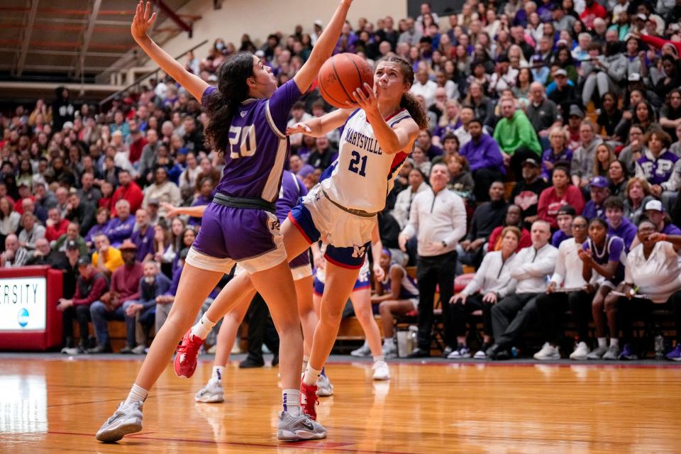 JoJo Eberhart (21) helped Marysville win its first district title last winter.