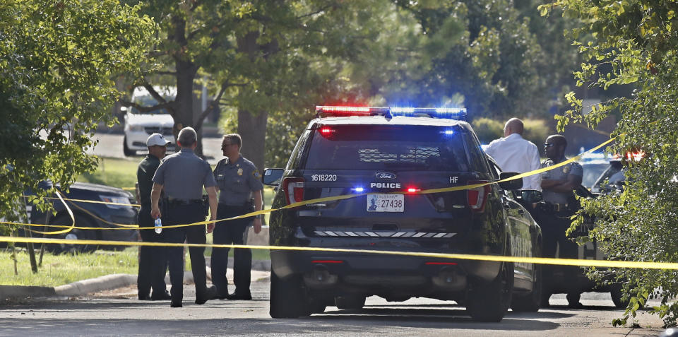 Crime scene tape closes off an area where a shooting suspect was fatally shot during a police chase Monday, Sept. 9, 2019, in northwest Oklahoma City. (AP Photo/Sue Ogrocki)