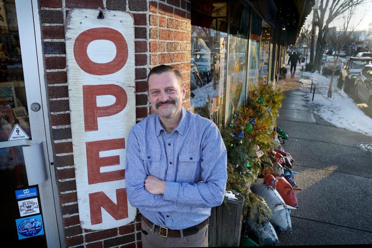 Asher Schofield, owner of the Frog and Toad stores in Providence, at the Hope Street store on Monday.  [Kris Craig/The Providence Journal]
