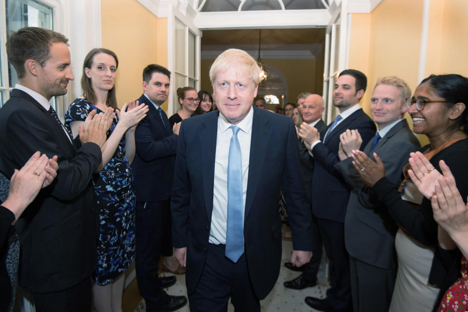 Prime Minister Boris Johnson is clapped into 10 Downing Street by staff after seeing Queen Elizabeth II and accepting her invitation to become Prime Minister and form a new government.