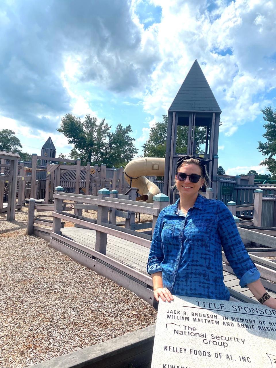 Courtney Pelham, president-elect of the Elba Rotary Club, stands at Tiger Town playground in Elba, Alabama, on June 27, 2023. For the 20th anniversary of the playground in 2026, the civic club wants to revamp the space.