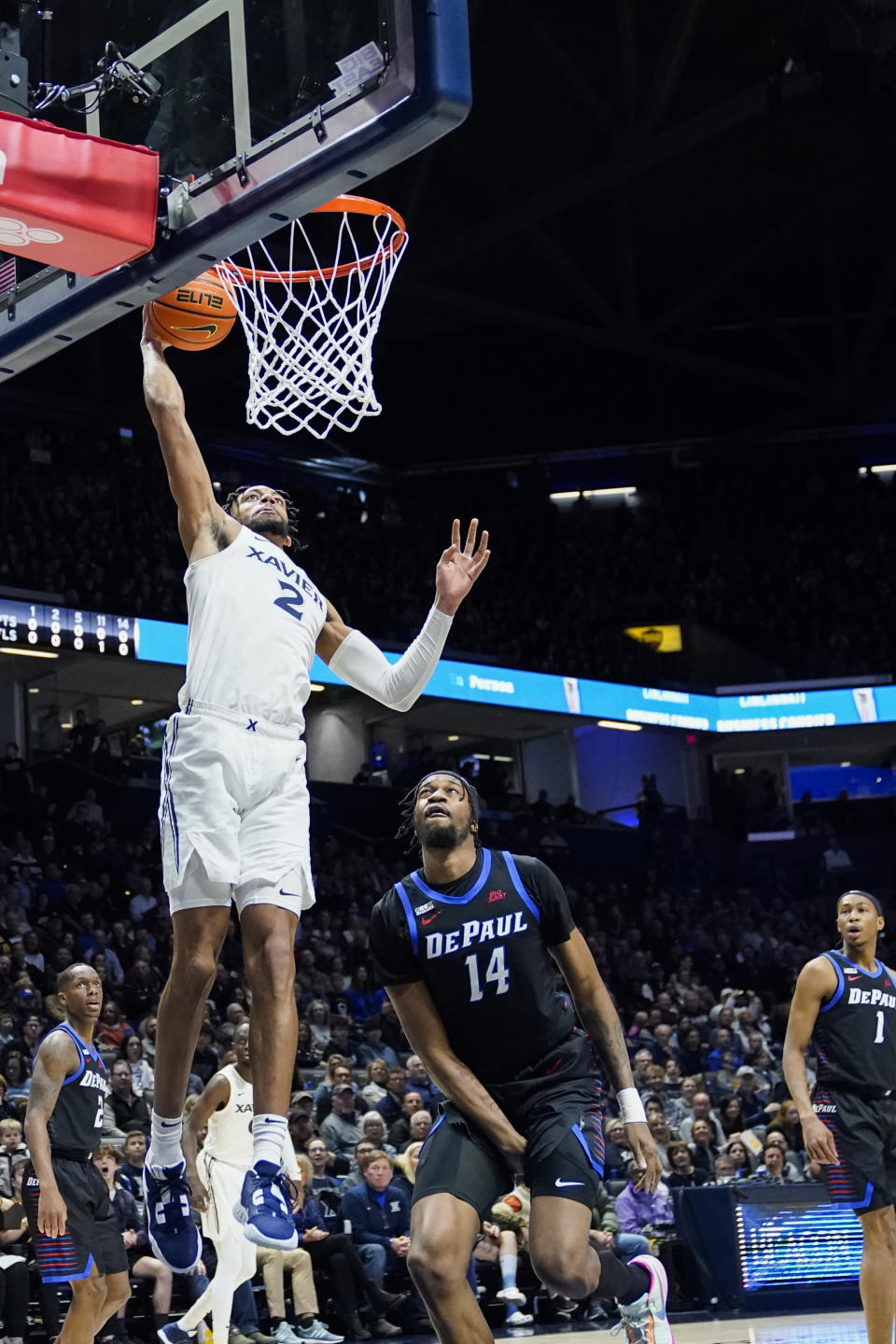 Xavier forward Jerome Hunter (2) dunks during the first half of an NCAA college basketball game against DePaul, Saturday, Feb. 18, 2023, in Cincinnati. (AP Photo/Joshua A. Bickel)