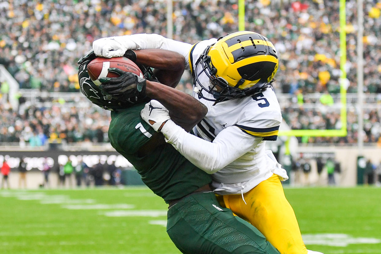 EAST LANSING, MI - OCTOBER 30: Michigan State Spartans wide receiver Jayden Reed (1) makes a leaping grab on a two-point conversion during a college football game between the Michigan State Spartans and the Michigan Wolverines on October 30, 2021 at Spartan Stadium in East Lansing, MI. (Photo by Adam Ruff/Icon Sportswire via Getty Images)