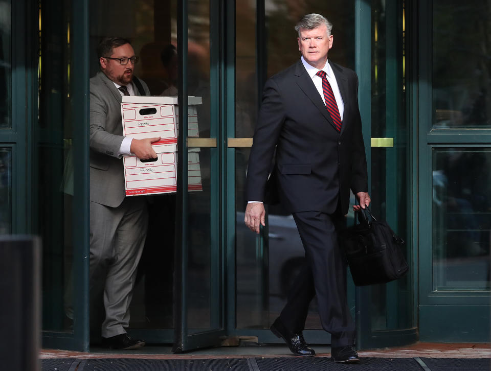 Attorney Kevin Downing, right, who is representing two associates of Rudy Giuliani, Lev Parnas and Igor Fruman, walks out of a federal courthouse after a hearing in Alexandria, Va., on Oct. 10, 2019. | Mark Wilson—Getty Images