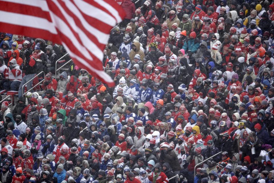 Hockey fans pack Michigan Stadium as they watch the first period of the Winter Classic outdoor NHL hockey game between the Detroit Red Wings and the Toronto Maple Leafs in Ann Arbor, Mich., Wednesday, Jan. 1, 2014. (AP Photo/Carlos Osorio)