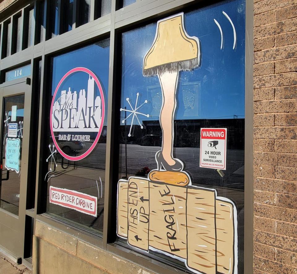 The windows of The Speak Bar & Lounge in downtown Chickasha are decorated for the holidays with iconic images from the 1983 film "A Christmas Story" on Nov. 28. The bar is just down Chickasha Avenue from the Chickasha Leg Lamp, a 50-foot-tall statue based on a famous prop from the movie.