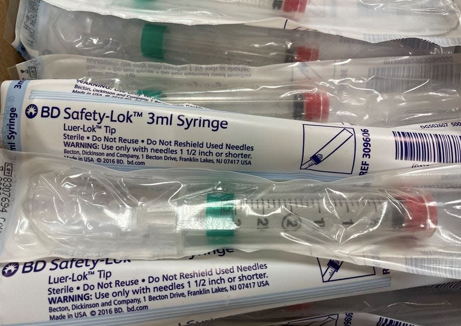 A box of unused syringes sits on a table at the Havert L. Fenn Center in Fort Pierce on Monday, Aug. 23, 2021. Gov. Ron DeSantis announced the facility would become a monoclonal antibody treatment site for COVID-19 patients.