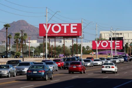 Billboards encouraging people to vote are seen following the U.S. Midterm elections in Phoenix, Arizona, U.S. November 7, 2018.   REUTERS/Elijah Nouvelage