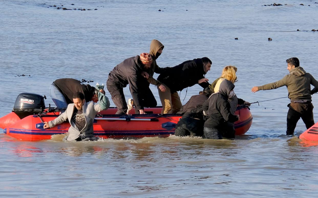 Migrants make a beach landing near Dover - STEVE FINN