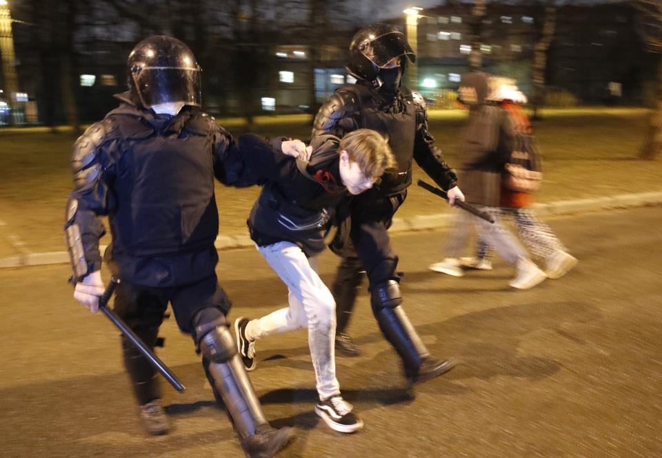 Police detain a man during a protest in support of jailed opposition leader Alexei Navalny in St. Petersburg, Russia, Wednesday, April 21, 2021. Large numbers of people have been detained across the country in connection with the protests.(AP Photo/Dmitri Lovetsky)