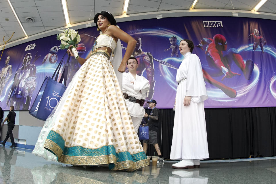 Cosplayers chat at the D23 Expo Saturday, Sept. 10, 2022, in Anaheim, Calif. (AP Photo/Mark J. Terrill)