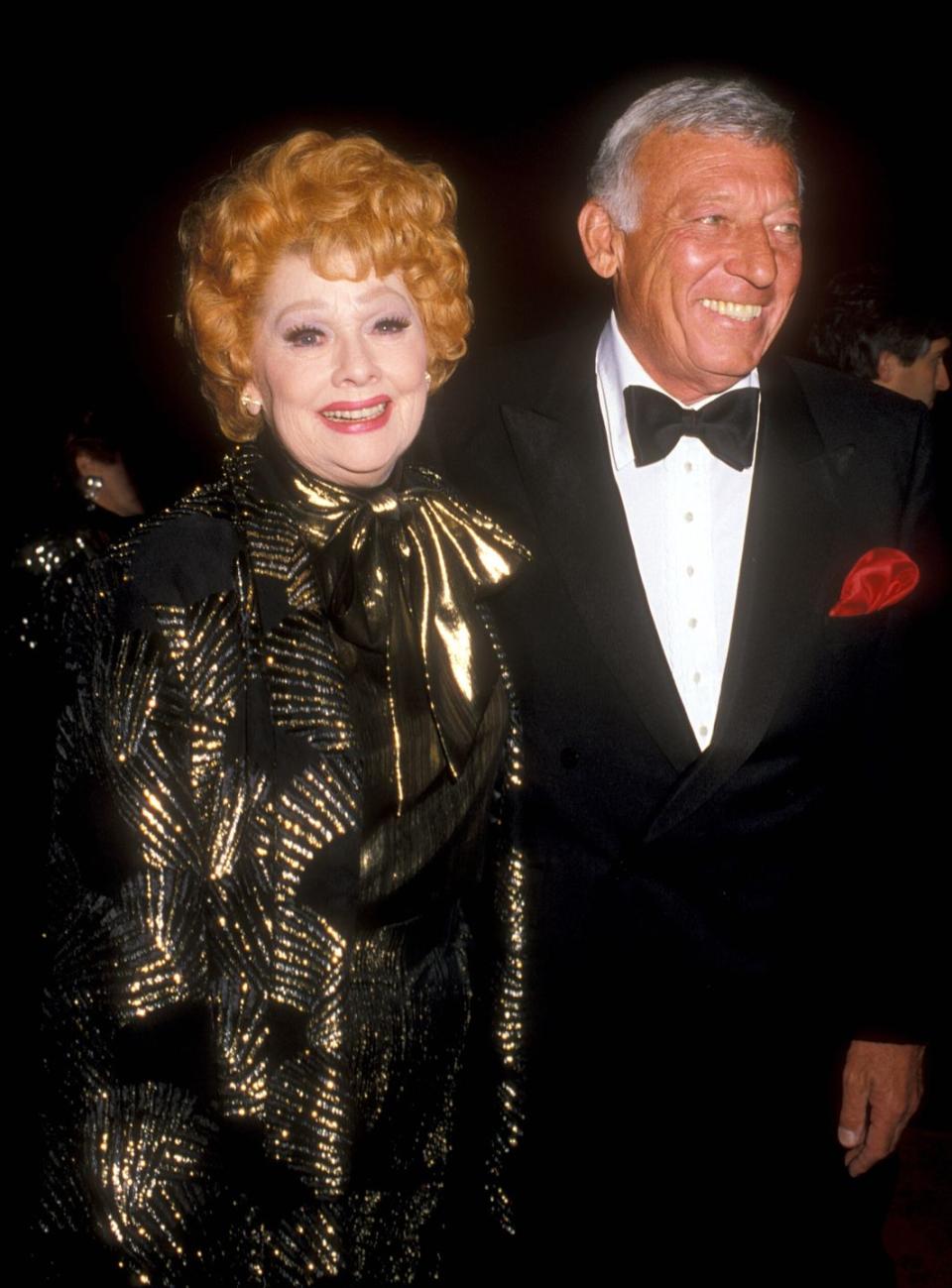 1987: Grinning with Gary in a gorgeous golden and black gown.