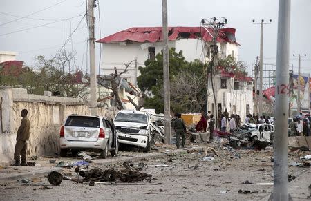 Somali government soldiers stand near the ruins of the Jazeera hotel after an attack in Somalia's capital Mogadishu, July 26, 2015. REUTERS/Feisal Omar