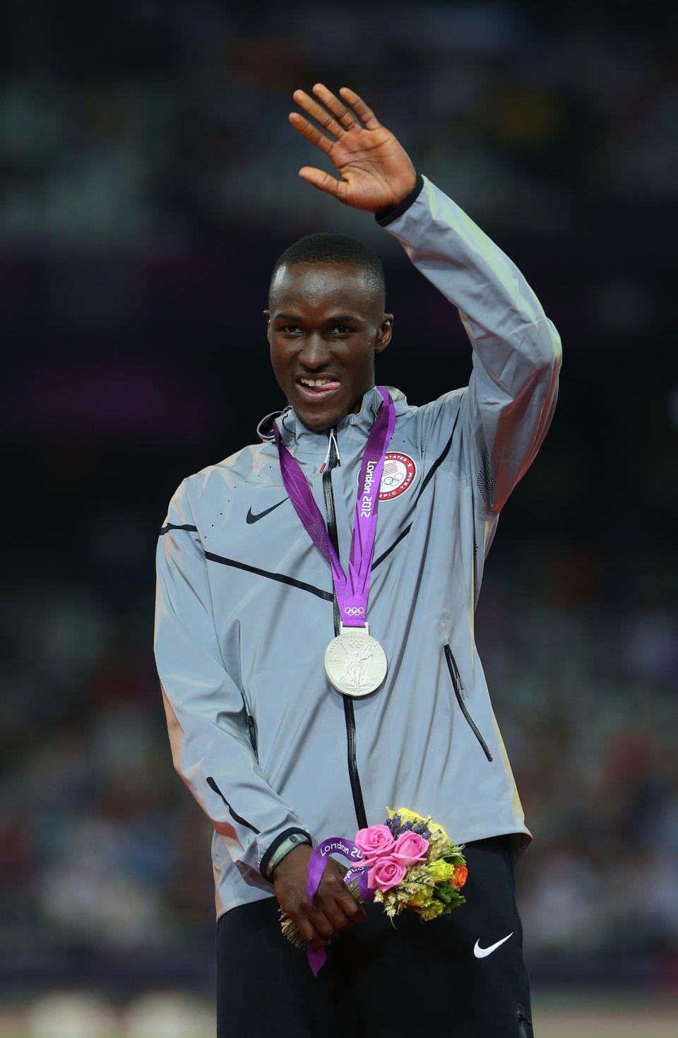 Silver medalist <a href="http://sports.yahoo.com/olympics/track-field/will-claye-1135588/" data-ylk="slk:Will Claye;elm:context_link;itc:0;sec:content-canvas" class="link ">Will Claye</a> of the United States celebrates on the podium during the medal ceremony for the Men's Triple Jump on Day 13 of the London 2012 Olympic Games at Olympic Stadium on August 9, 2012 in London, England. (Getty Images)